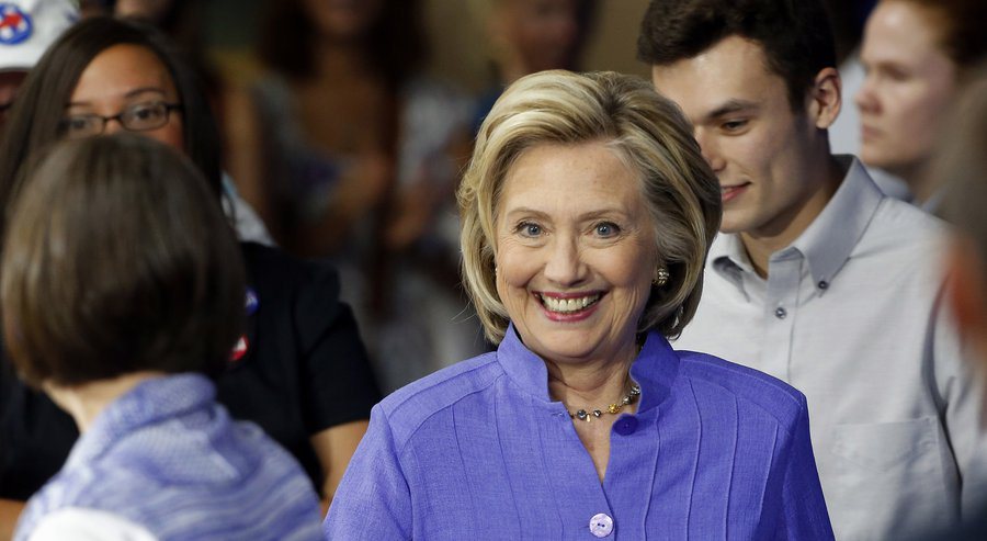Hillary announces her college degree subsidy program in New Hampshire. In Texas they have a term for that kind of fake grin. (Source: Associate Press)