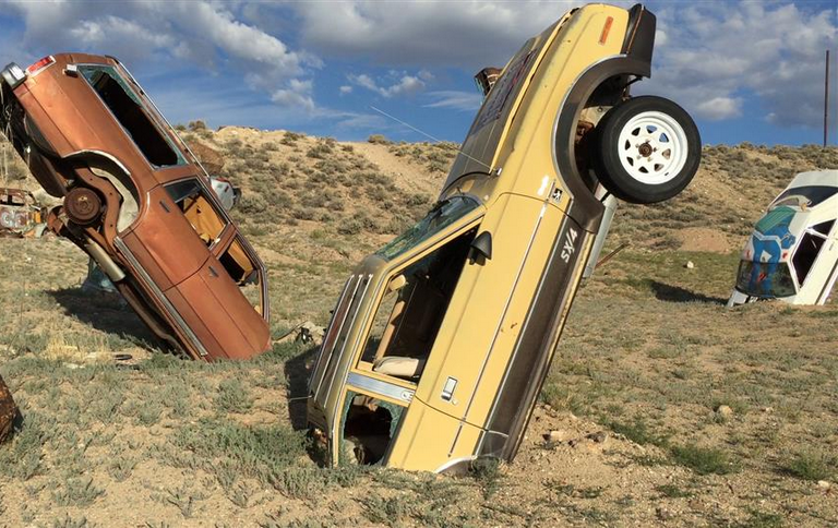 Near the small town of Tonopah, Nevada, sits the International Car Forest of the Last Church -- a dirt lot filled with old cars sticking out of the ground. (Photo by Jim Carlton, The Wall Street Journal)